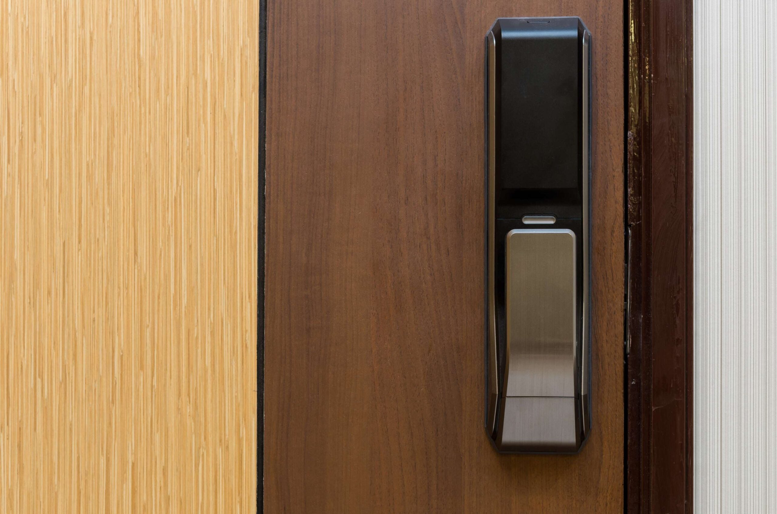 Digital door lock installed on a wooden door, showcasing modern security features relevant to residential locksmith services.