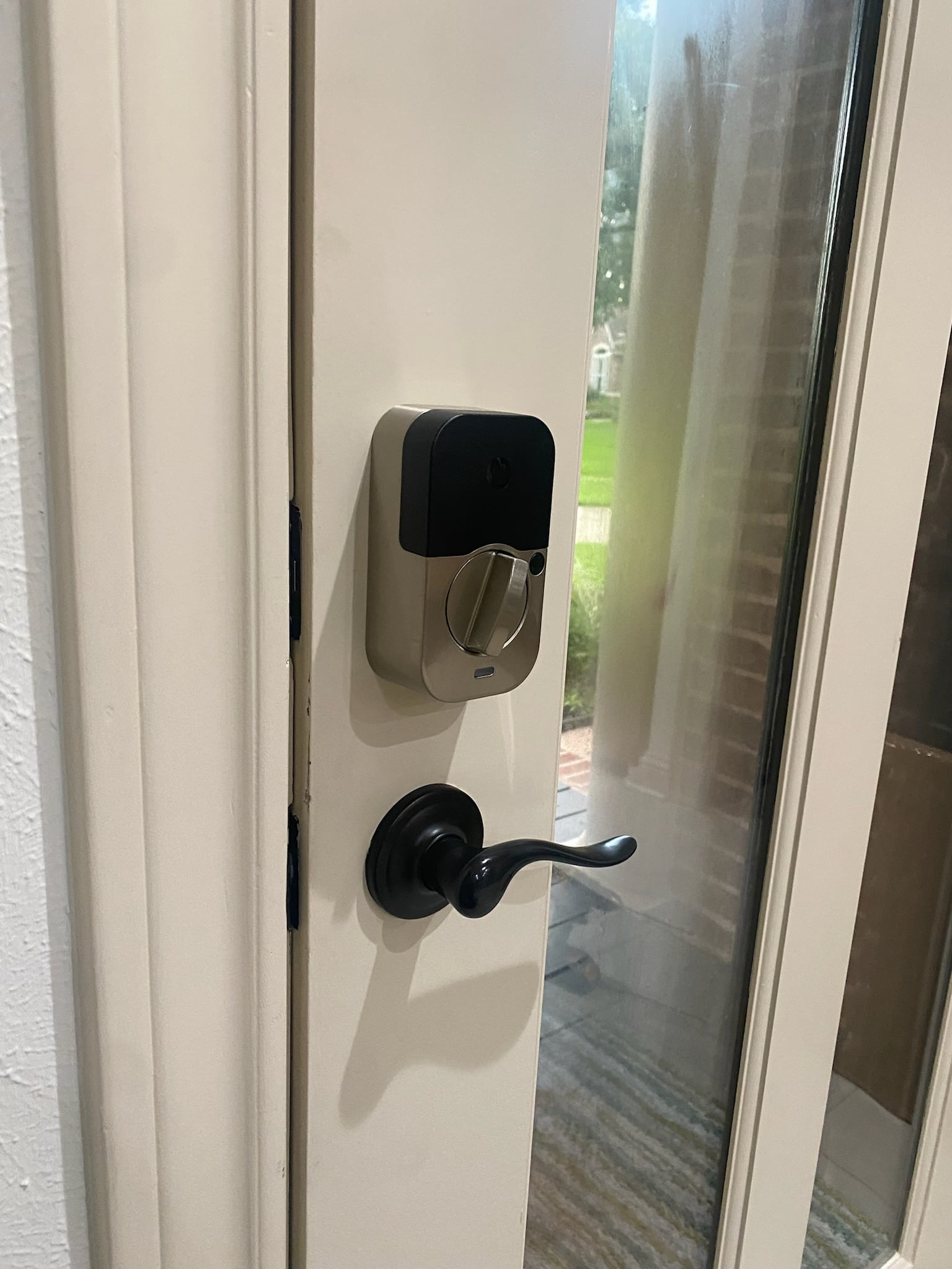 Modern smart lock on residential door, emergency lockout service.
